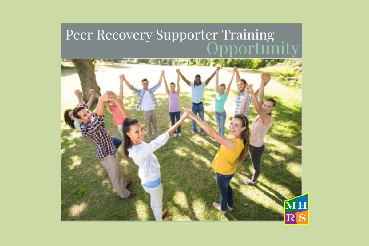 Image of a group of people holding hands for the Peer Recovery Supporter Training.