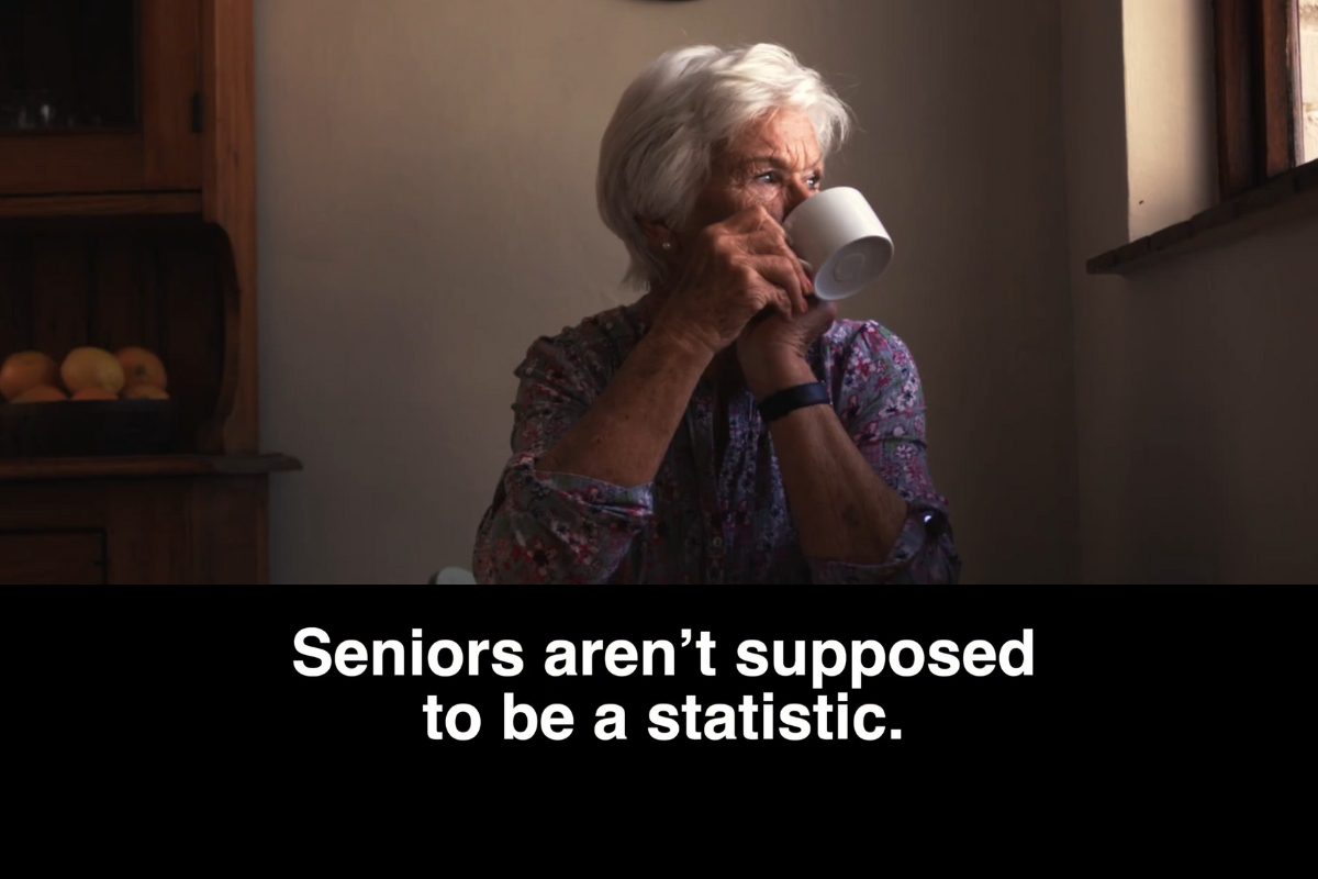 Senior drinking looking off with the words Seniors aren't supposed to be a statistic.